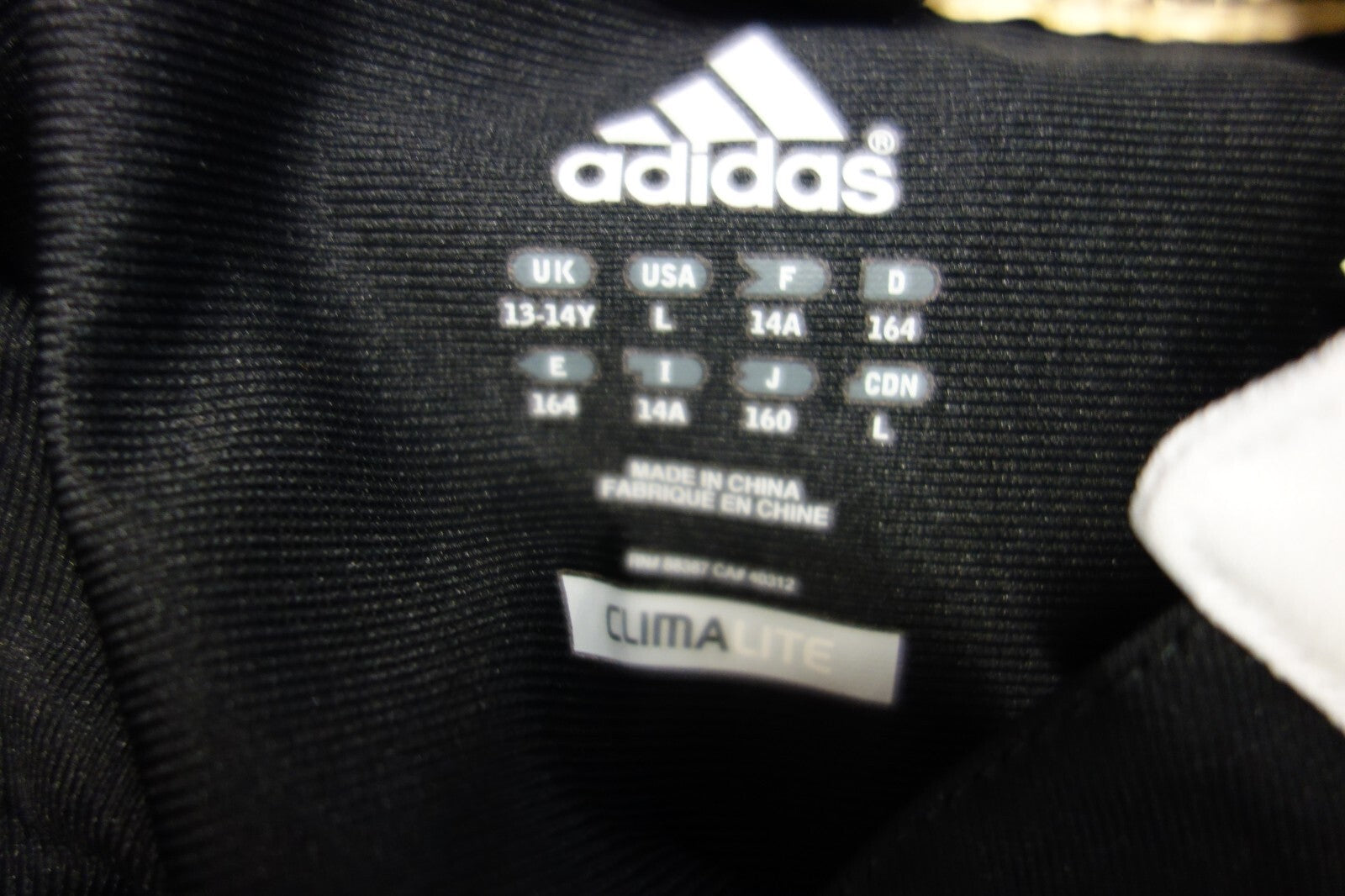EK1973 Kinder Sportoberteil, schwarz von adidas, Gr. 1646